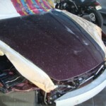 Before and after photographs of a damaged Porsche that was repaired by Elite Paint & Body Shop in West Palm Beach, Florida.